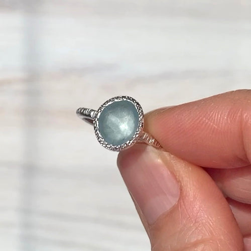 Textured silver and aquamarine ring
