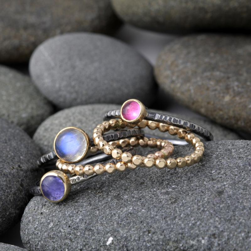 Gold and Oxidized gemstone stacking rings with Tourmaline, moonstone, and tazanite